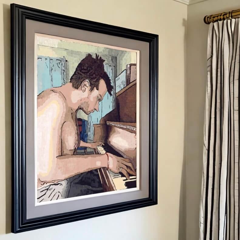 A man passionately plays the piano in a cozy room, captured in the framed art print titled "Ivory Keys."