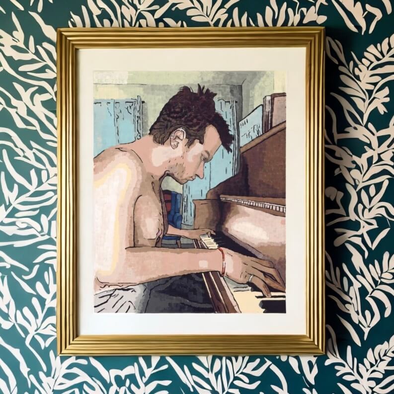 A man playing the piano in a framed art print titled Ivory Keys.