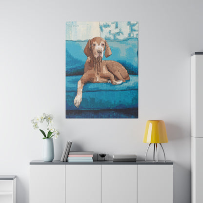  A painting of a canine resting on a blue sofa hanging in a cozy living space.