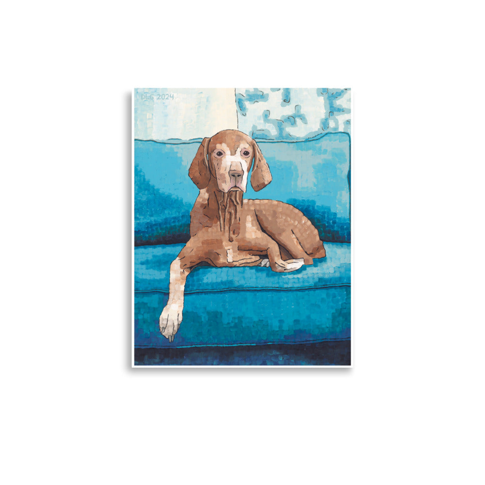 A art print of a adorable dog lounging on a blue couch, enjoying a cozy moment.